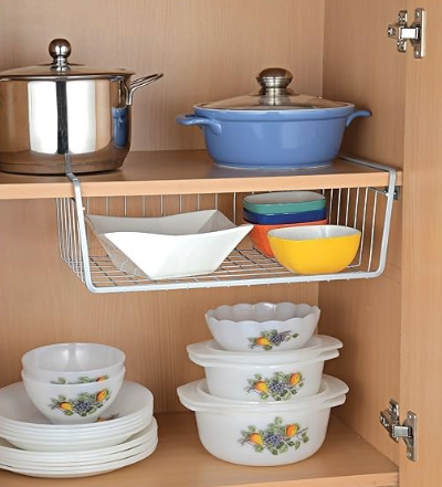 Undershelf rack in kitchen with plates, pots,pans, cups