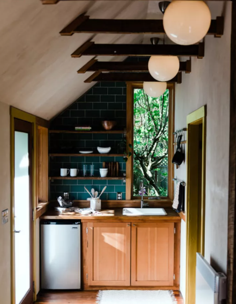 awkward angle wall with shelves in tiny kitchen