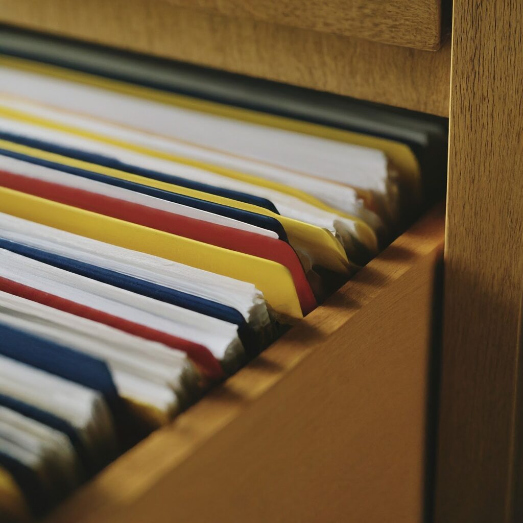 folders organized in alphabetical order in a file cabinet drawer