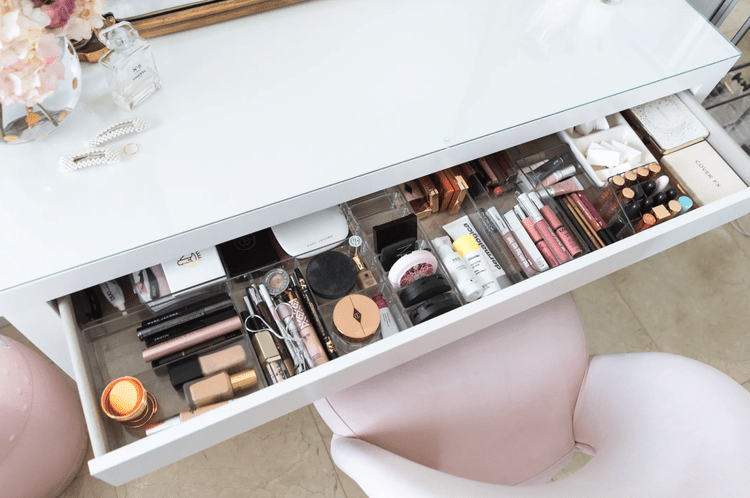 Organized dressing table drawer with makeup